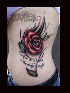 Daniel Adamczyk - rose side tattoo with quote